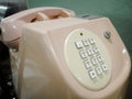 Vintage classic pink telephone. Old tone telephone. Royalty Free Stock Photo