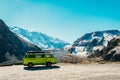 Caucasus Vintage classic van parked beside the road among the high Caucasus peaks on the far north of Georgia. Breath taking view