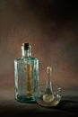 Vintage clinic medicine tinted glass bottle medisin glass mortar and pestle Studio shot