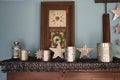 large wooden clock with tin christmas ornaments on a mantel Royalty Free Stock Photo