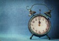 Vintage clock over blue ice bokeh background. new year concept. selective focus Royalty Free Stock Photo