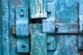 Vintage closed latch on weathered scratched wooden door. Concept of security and privacy protection. Textured grunge background