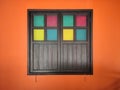 Vintage closed wood window on orange wall background Royalty Free Stock Photo