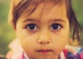 Vintage closeup portrait of Cute sad kid with big eyes Royalty Free Stock Photo