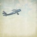 Vintage cloudy background with plane