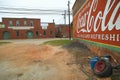 Vintage Coca Cola advertisement sign painted on side of old building in Plains, Georgia