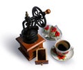 Vintage coffee grinder and cup of coffee Royalty Free Stock Photo