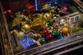 Transparent glass tabletop of coffee table with shiny Christmas baubles under glass tabletop