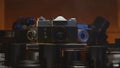 Vintage collection of old vintage cameras and lenses. Plunge into the atmosphere of professional photography of the last Royalty Free Stock Photo