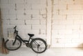 Vintage color effect on classic bicycle parking on white concrete wall block