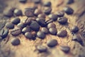 Vintage color tone, coffee beans on the old wooden background Royalty Free Stock Photo