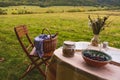 Vintage colored photo. Table prepared for lunch in autumn nature, picnic