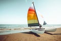 Vintage colorful sailboat on tropical beach in summer.