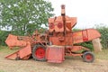 Vintage Combine Harvester in a field Royalty Free Stock Photo