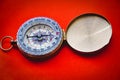 Vintage compass close up on red background Royalty Free Stock Photo