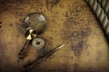 Vintage Compass and magnifying glass lies on an ancient world map - adventure stories background Royalty Free Stock Photo