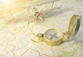 A vintage compass on the map and an airplane Royalty Free Stock Photo