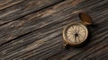 Vintage compass on rustic wooden surface Royalty Free Stock Photo