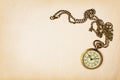 Vintage pocket watch on yellowed paper Royalty Free Stock Photo