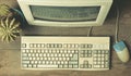 Vintage computer on a wooden table.