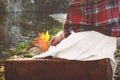 Vintage concept with a young woman holding an autumn leaf in her Royalty Free Stock Photo