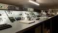 Vintage control room with rows of analog dials, switches, and monitors offering a nostalgic glimpse into industrial technology Royalty Free Stock Photo