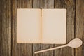 Vintage cookbook top view on old wooden food background