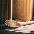 Vintage cookbook on wooden background, closeup view