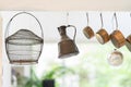 Vintage cooking pans kettle basket hanging from the ceiling.