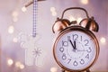 Vintage Copper Alarm Clock Showing Five Minutes to Midnight. New Year Countdown. Wood Christmas Tree Deer Ornament Hanging Royalty Free Stock Photo