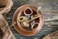 Vintage copper cup and keys with LOVE and DREAM inscriptions on the old wooden background.Top view