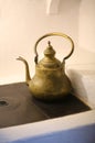 Vintage copper kettle standing on the stove