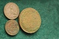 Vintage copper and silver russian coins on a green background
