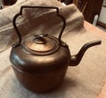 Vintage Copper Tea Kettle with Bird Handle on Burlap Background Royalty Free Stock Photo