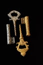 Vintage corkscrews in the form of a key on a black background