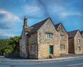 Vintage Cotswold style buildings in an old UK village in the summer on a sunny day Royalty Free Stock Photo