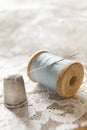 Vintage Cotton Reel With Needle And Silver Thimble Royalty Free Stock Photo
