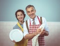 Vintage couple dish washing together Royalty Free Stock Photo