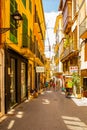 Vintage cozy narrow streets of palma de mallorca in the sommer with many tourists