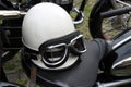 Vintage crash helmet and protective goggles on motorcycle seat Royalty Free Stock Photo