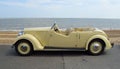 Vintage Cream Coloured Rover Motor Car Parked on Seafront Promenade.