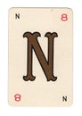 Vintage cream playing card showing the letter N in gold.