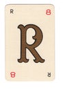 Vintage cream playing card showing the letter R in gold.