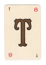 Vintage cream playing card showing the letter T in gold.