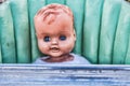 Vintage Creepy Doll Sitting in An Old Baby High Chair
