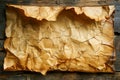 Vintage Crinkled Brown Paper Texture with Frayed Edges and Cracks on Rustic Wooden Background