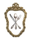 Vintage crossed spoon, fork and knife in silver openwork golded frame isolated on white background