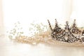 Vintage crown and pearls necklace. Wedding concept. Back light