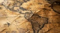 Vintage crumpled paper world map on table, old brown worn rare sheet, background for journey theme. Concept of antique, history, Royalty Free Stock Photo