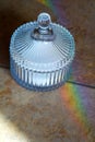 Vintage crystal sugar bowl with sugar refracts the light and lets out a rainbow